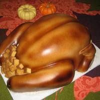 Turkey Day 2010 Turkey with stuffing! This was a fun cake to make and serve on Thanksgiving. Fondant covered with brown airbrush to get the "baked&...