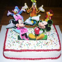 Mickey Mouse Club House Cake yellow cake, buttercream frosting. embellishments are paper