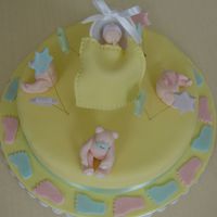 Bears And Baby made a vanilla cake covered in fondant filled with chocolate... bears, baby and stars are fondant and a wilton cradle