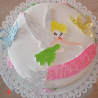 Tinkerbell Birthday Cake Tinkerbell birthday cake filled with rasberry en covered with fondant all figures made out of fondant. TFL