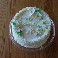 Daisy Cake Carrot cake with crusting cream cheese buttercream and fondant accents. I need practice with my writing.
