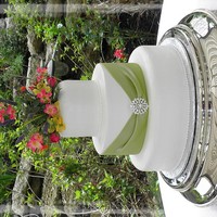 Mccartyhall Cake made to match bridesmaids dresses. All buttercream with fondant sash and real broach.