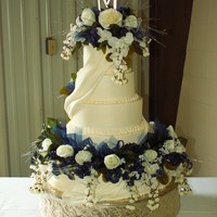 Brinkmanmorgan My first Fondant sash. The bottom layer of flowers were out of control! LOL