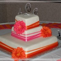 Pink And Orange fondant covered with satin ribbons