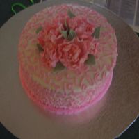 Cornnelli Lace And Fantasy Gumpaste Flowers this is an 8" trippled torted chocolate cake filled with chocolate ganache and raspberry filling. I decorated it for a friends baby...