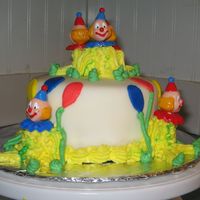 Smash Cake fondant covered smash cake with buttercream clowns