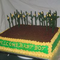 John Deere This is a john Deere themed baby shower cake with gumpaste corn stalks. I used "Oreo" cookies and "teddy Grahams" for...
