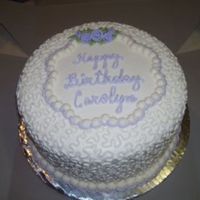 Carolyn_Resize.jpg 10 inch round. All buttercream except for fondant ribbon roses.