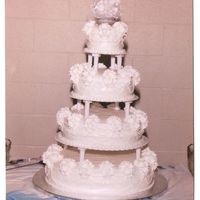 Maria's Cake My very first wedding cake ever!!! Made for my little sister to match the one in the Wilton Wedding Cakes book from a few years ago....