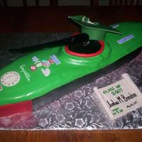 Graduation Kayak Cake Chocolate cake covered in fondant.