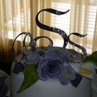 Purple Roses & Cala Lilies From a wedding cake I made this past weekend. This was the topper. It really dressed up an otherwise simple cake