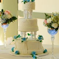 Marshmallow Fondant Blue Roses Wedding Cake This was for a friend. I wasn't crazy about the blue roses or the columns but she REALLY wanted the columns and the blue roses. I felt...
