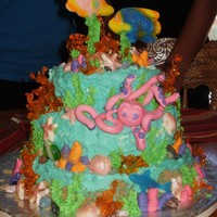 Under The Sea my 11 y/o neices b-day cake iced in buttercream orange coral made with isomalt, multi color coral buttercream, gumpaste octopuss, fish on...