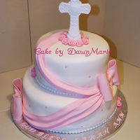 Girls Communion Cake White fondant, Fondant pearls & drapes, Fondant/gumpast bows. She gave me a picture of a cake she found on the computer that she wanted...