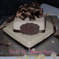 Ivory Bridal Shower Cake MMF with chocolate/raspberry ganache filling. This was my 1st ever stacked cake, I got the top tier on the 1st try! The bow & ribbons...