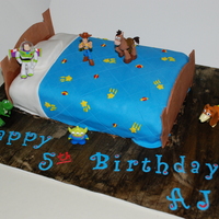 Toy Story Cake This was for my son's 5th birthday. Gumpaste foot/headboard, Fondant bedding, RI stars & planets. Toys from target