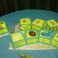 Baby Blocks 8 4" baby blocks with animals and numbers. All blocks were cut from 8" square, iced in buttercream and the animals were piped...