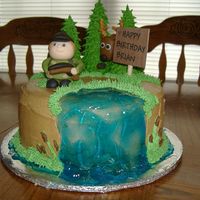 Bdaycake_003.jpg white cake w/ bc, trees are royal on ice cream cones, deer and hunter are mmf.