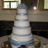 Maggie's Cake Pound cake w/ bc icing, fondant pearls and fondant ribbon/bows.