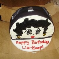 Betty Boop Purse 8" round cake with bottom cut flat. The handle, clasp and top of cake is fondant, the rest of the cake is iced in buttercream. The...