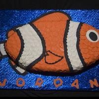 Nemo Silhouette Light vanilla rum cake, filled and lightly coated with butter cream then topped with fondant. This baby took a long time to decorate, but...
