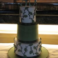 50Th Birthday Buttercream, fondant leaves and satin ribbon. Customer provided me a picture of a wedding cake, sorry I can't give credit for the...