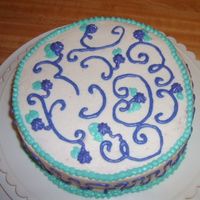 Practice Cake the cake is strawberry cake with buttercream frosting