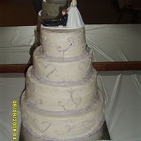 My First Wedding Cake cakes are 6,8,10 and 12 inch the reception hall was so hot the scroll work and frosting was sliding off the cake. Sorry the picture is the...