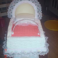 For Sara's Baby Shower The hood is made of white chocolate and buttercream, The cake is a yellow butter cake and the Icing is buttercream. I made cookies for the...