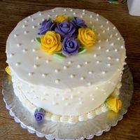 Dscf2313.jpg Diane's birthday cake, almond sour cream cake, cherry filling, iced in butter cream with fondant roses. 4/09