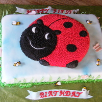 Twins' First Birthday Bottom tier: 12"x18" two layer lemon cake with blackberry mouse filling, covered in lemon fondant with fondant bugs, grassblades...