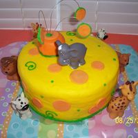 Yellow With Orange Polka Dots Birthday Cake My son was having an animal party for his 2nd birthday. I used two 9 inch cakes on with buttercream in the middle. The outside is also...