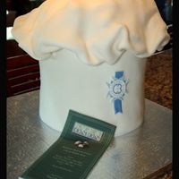Culinary Grad So this cake was massive, it was a 2, 12" round that were 4" tall stacked to make this massive hat. I made up the menu so I could...