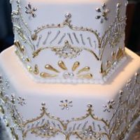 Rima This was for a first anniversary and she wanted it to have a lot of elegance with gold and silver while relecting the design work of her...