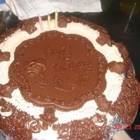 For My Husbands I used the wilton chocolate fantasy instructions for 1998 - the frosting is mocha, and I couldn't find the pattern book, so I used...