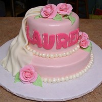 Pink Roses & Fondant Swag This cake is covered with marshmallow fondant and decorated with fondant/gumpaste roses.