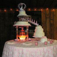 Granddaughter's Wedding Cake White cake - tiered with fountain in the center and stairs to hold wedding party