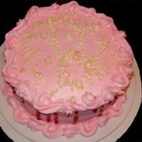 Whitechocolaterasp.jpg Simple white chocolate raspberry cake with raspberry drizzled down the sides and white chocolate shavings on top.