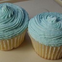 Blueberrycupcakes.jpg Blueberry cake and frosting. I replaced some of the water in the cake and frosting with blueberry cobbler creamer. Frosting was swirled on...