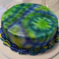 Father's Day White buttermilk cake with buttercream. First attempt at airbrushing. Tie dye for dad. 9" round tie dyed frosting and three colors...