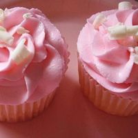 Baby Shower White Chocolate Raspberry cupcakes and frosting with white chocolate shavings. These are becoming a favorite for a lot of people! Pink for...