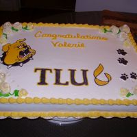 Bulldog Graduation Fondant flowers and beads with color flow college mascot and paws.