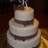 Rhinestone Wedding Dark Chocolate and WASC with BC and ivory fondant topped with Lusterdust. Fondant and gumpaste bows and ribbons with pink polka dots. LOVED...