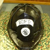 Fire Helmet Cake Basic cake, covered in rolled fondant. Life size helmet, people at Christmas party didn't even realize it was a cake at first! I was a...