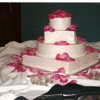 Round And Square Wedding Cake With Dots And Rose Petals 
