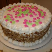 Valentine's Day Party At Church Butter Pecan cake, with pecans on side and rosebuds and vines on top. Buttercream Frosting