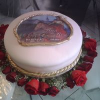 Kentucky Derby Run For The Roses Vanilla and buttercream covered in fondant layered with real red roses. (image on top is NOT edible)
