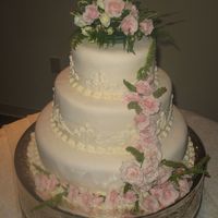 My First Wedding Cake My very first wedding cake! Almond/ Vanilla cake with Bavarian Creme filling covered in MMF! All from recipes shared on this site. It was...