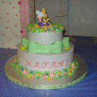 Tinkerbell Cake 10" and 6" vanilla and chocolate cakes with Marshmallowcream Buttercream icing. Icing flowers and fondant bow.