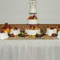 First Wedding Cake Buttercream frosting with royal icing detailing (from bride's dress). Silver dust on initials. Fresh flowers used.